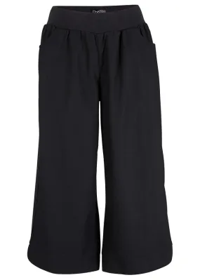 Pantalón holgado de lino con cinturilla cómoda y largo capri Negro